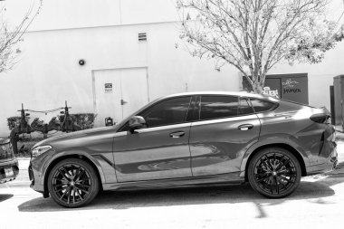 Miami Beach, Florida USA - April 15, 2021: parked blue bmw x6 sdrive 40i, side view.