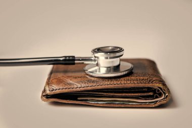 expensive medicine concept. stethoscope and wallet as symbol of expensive medicine. healthcare and medicine are expensive. closeup.