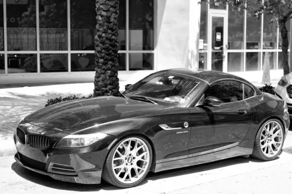 stock image Miami Beach, Florida USA - April 15, 2021: 2010 BMW Z4 sDrive35i roadster car, side view.