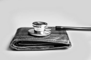 expensive medicine concept. stethoscope and wallet as symbol of expensive medicine. healthcare and medicine are expensive. closeup.