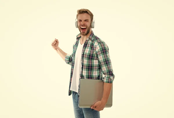 laughing millennial man student in studio. photo of millennial man student with laptop. millennial man student isolated on white. millennial man student on background.