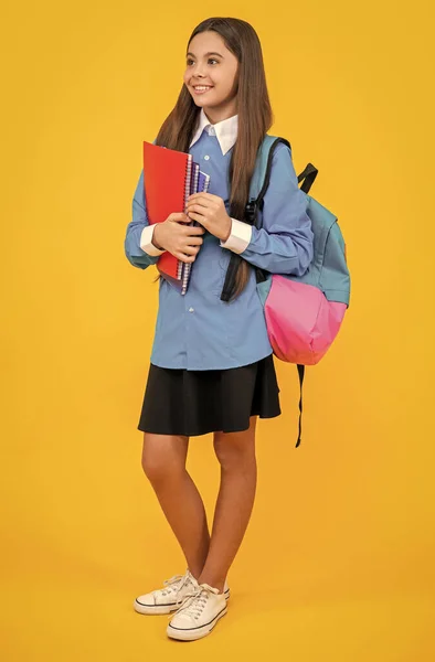 back to school. knowledge and education. college student girl. teen girl gets high education. education in school. teen girl holding workbook. study at school lesson. new lessons and learning.