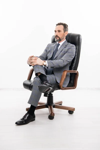 businessman in office chair. man in suit representing leadership. business leadership and success. businessman leader sit in office chair. business success. professional leader ceo. financial advisor.