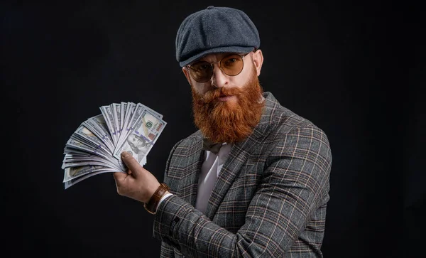 Rich man in retro suit. Brutal gentleman has successful business. Man with casino money. Bearded man businessman. Rich Englishman. Retro man isolated on black. Englishman with money. Millionaire.