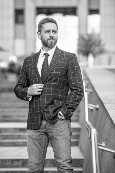 adult businessman outdoor. businessman in jacket. caucasian businessman standing outside. professional businessman in formalwear.