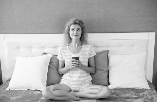 dreamy woman with morning coffee in bed. good morning. woman with coffee cup. woman hold coffee in the morning.