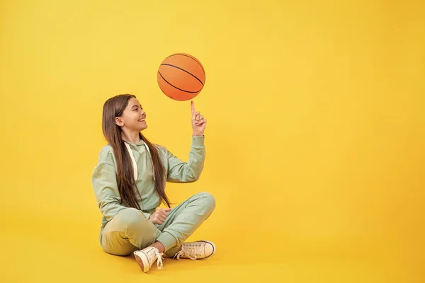 stock image Teen girl excelling in basketball. Skilled teen girl playing the basketball. Competitive teen girl playing basketball. teen girl practicing basketball skills. copy space advertisement.