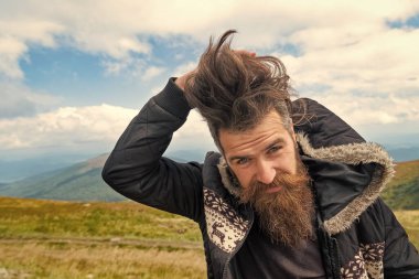 photo of bearded man in the mountain with copy space. bearded man outdoor. bearded man has beard. bearded man having moustache.