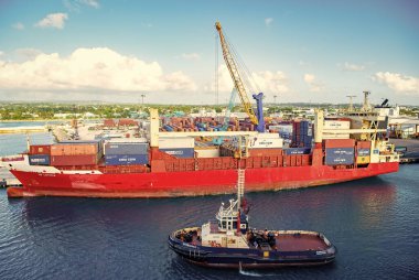 Bridgetown, Barbados - December 12, 2015: cargo transport ship with container in harbour.