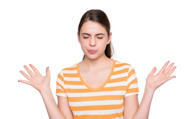 displeased young girl in summer striped tshirt isolated on white background.