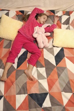 teen girl sleep at bedtime. teen girl sleep at bedtime in comfortable bed. teen girl sleep at bedtime in bedroom. teen girl sleep at bedtime wearing pajama.