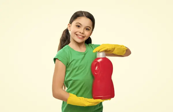 stock image smiling girl cleaner with detergent on background. photo of girl cleaner with detergent. girl cleaner with detergent isolated on white. girl cleaner with detergent in studio.