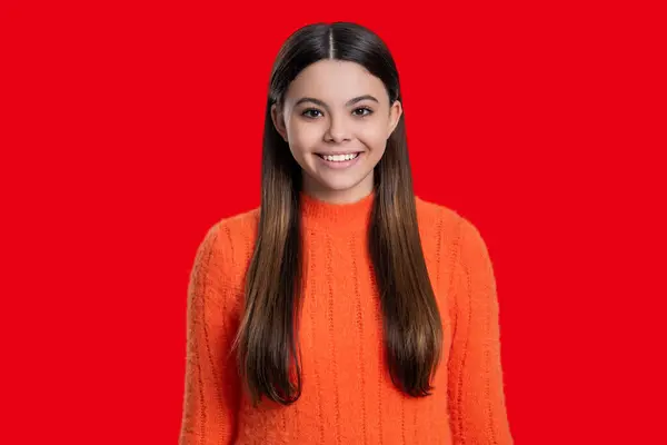 stock image Headshot portrait of happy teen girl isolated on red. Teen girl looking at camera. Casual style. Stylish girl has long hair. Teen monochrome fashion style. Style for girl. Radiant smile.