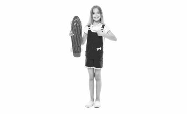 teen girl skateboarding isolated on white, pointing finger. teen girl skateboarding in studio. teen girl skateboarding on background. photo of teen girl skateboarding. clipart