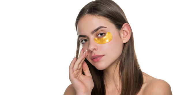 Collagen hydrogel eye patches. Skin with moisturizing patches under eyes. Young woman using patches under eyes, copy space. Beauty woman with eye patches has perfect skin. Banner.