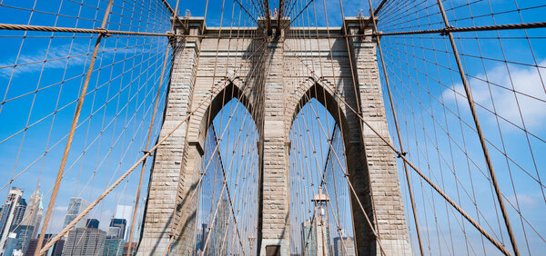 Architecture of historic bridge in Brooklyn. Brooklyn bridge of New York city. New York bridge connecting Manhattan and Brooklyn. Brooklyn bridge in NY, USA. Landmark in New York.