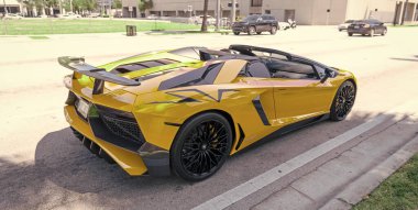 Miami Beach, Florida USA - April 15, 2021: yellow Lamborghini Aventador LP 750-4 SV, back view.