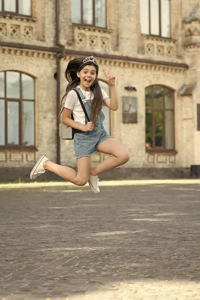 Happy teen kid jump. energetic teen girl jump outdoor. free teen child jump.
