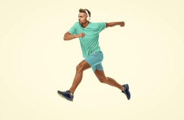 active sportsman jogger running. The sportsman running at full speed towards the finish line. sportsman runner running isolated on white. Man sportsman running for exercise in studio. clipart