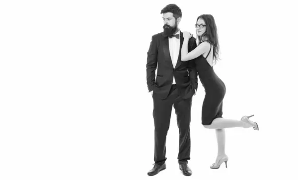 stock image couple in love flirting. love date for man and woman. formal couple of tuxedo man and sexy girl. engagement and proposal. valentines day. pure elegance. celebrate special occasion.