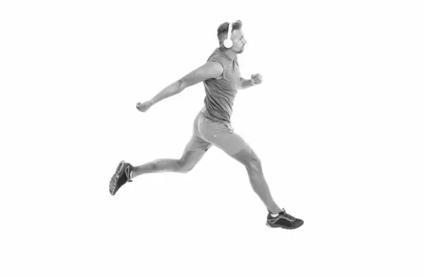 stock image runner sprinting with incredible speed. sport competition. runner at a long sport run. runner run isolated on white studio. sport runner crossed the finish line after completing a marathon.