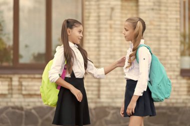 two school students friends talking together outdoor. communication.