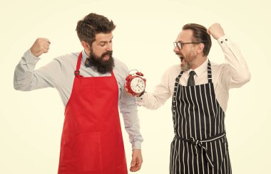 fast food. bearded men with alarm clock. lunch time. catering business. men competition in cooking. chef team in apron. Food delivery. deadline. cafe and restaurant opening. fast food delivery.