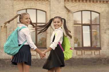 two school girls best friends together outdoor. copy space.