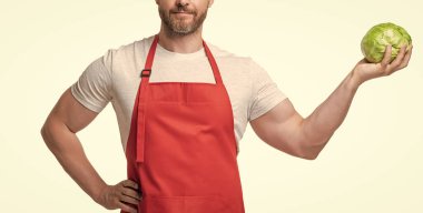 cropped view of man in apron with ripe cabbage vegetable isolated on white.