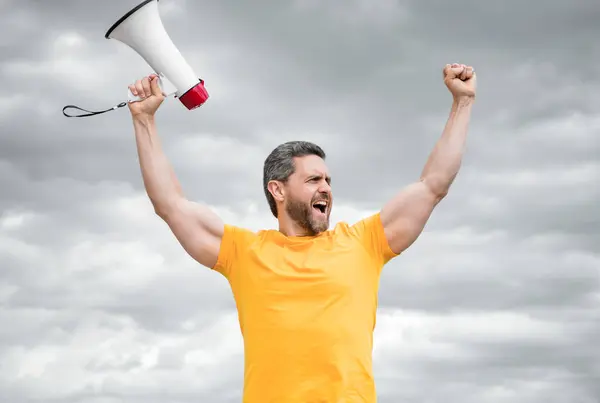Man Yellow Shirt Shout Holding Loudspeaker Sky Background — Stock Photo, Image