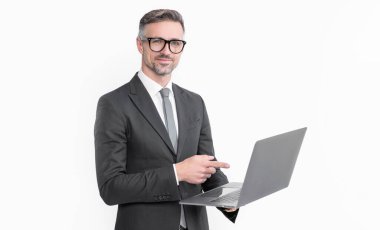 cheerful mature businessman working on laptop isolated on white background.
