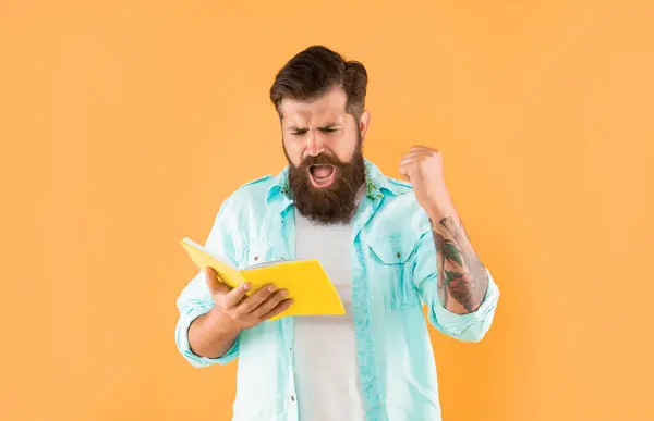 Shouting Hipster Guy Reading Notebook Yellow Background Success Imagen De Stock