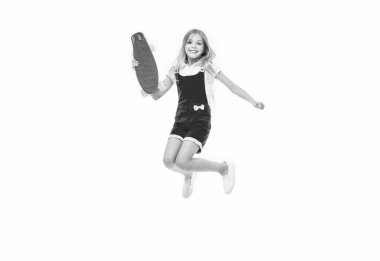 jumping teen girl skateboarding. teen girl skateboarding isolated on white. teen girl skateboarding in studio. teen girl skateboarding on background. clipart