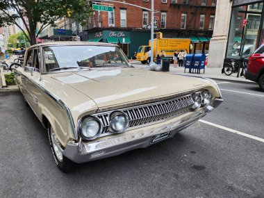 New York City, USA - August 17, 2023: Mercury Montclair 1964 vintage car parked at the street, front corner view. clipart