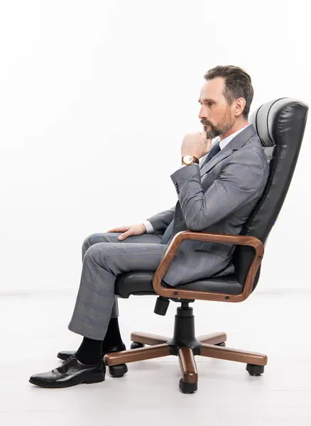 man in suit representing leadership. business leadership and success. businessman leader sit in office chair. business success. professional leader ceo. businessman in office chair isolated on white.