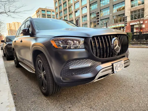 stock image New York City, USA - March 11, 2024: Mercedes Benz GL or GLS car luxury black color outside, corner view.