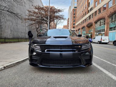 New York City, USA - March 01, 2024: 2020 Dodge Charger SRT Hellcat automotive brand car parked outdoor, front view. clipart
