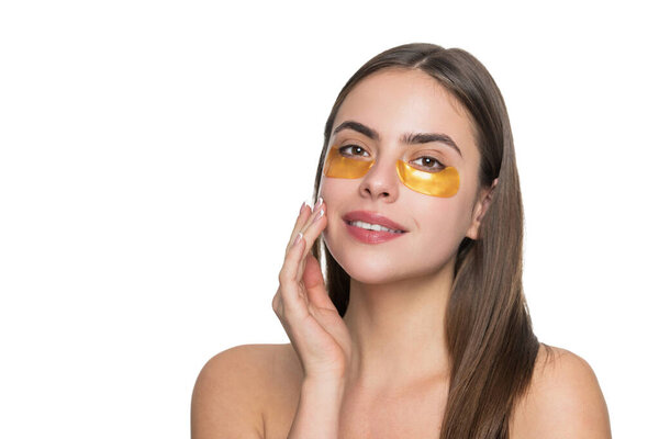 Woman applying eye patches. Spa care. Eye patch. Beauty woman face with under eye collagen pads. Woman has fresh healthy skin with collagen patches under eyes. Facial treatment. Reduce puffiness.