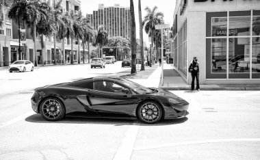 Miami Beach, Florida USA - April 15, 2021: mclaren limited 570GT MSO Black Collection, side view.
