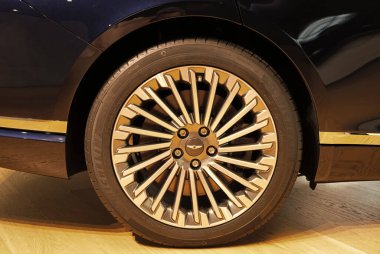 New York City, USA - August 06, 2023: Genesis G80 black Hyundai electric car driver wheel rim. clipart