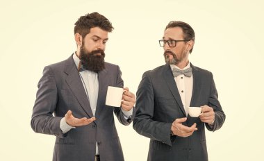 coffee break. Good morning. businessmen in formal suit with drink. business lunch. partners celebrate start up business. bearded men hold tea and coffee cup. Taking time to enjoy this morning. clipart