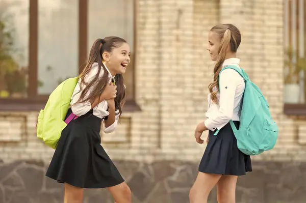 Two School Girls Friends Gossiping Together Outdoor Telifsiz Stok Fotoğraflar