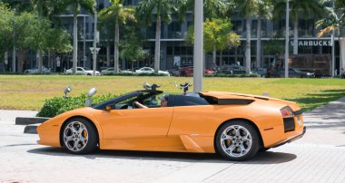 Miami Beach, Florida USA - April 15, 2021: yellow lamborghini diablo v12 6.2L, side view. convertible supercar.