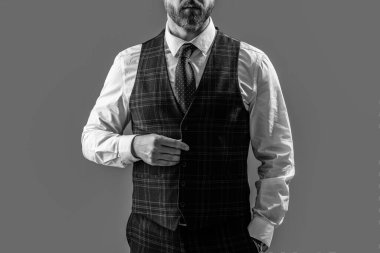 photo of businessman wear formalwear, cropped view. businessman in formalwear suit. businessman in formalwear isolated on grey background. businessman wearing formalwear in studio.