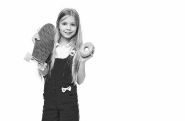 teen girl with skateboard and donut isolated on white, copy space. teen girl with skateboard in studio. teen girl with skateboard on background. photo of teen girl with skateboard. clipart