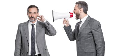 businessmen ignore shouting in megaphone isolated. businessmen ignore shouting in megaphone at studio. businessmen ignore shouting in megaphone. two businessmen ignore shouting in megaphone.