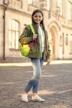 Happy teenage girl back-to-school on September 1, education.