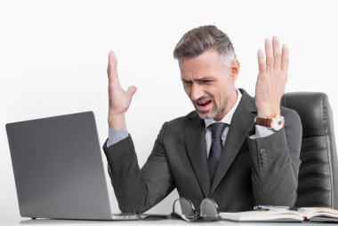 shouting overworked businessman sitting in business office.