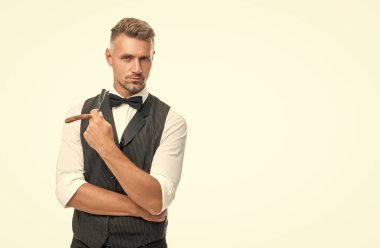 man barber with razor blade in bow tie isolated on white background with copy space.