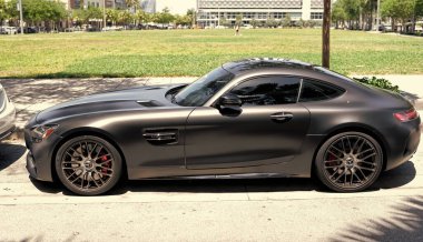 Miami Beach, Florida USA - April 15, 2021: matte mercedes benz v8 biturbo, side view high angle.
